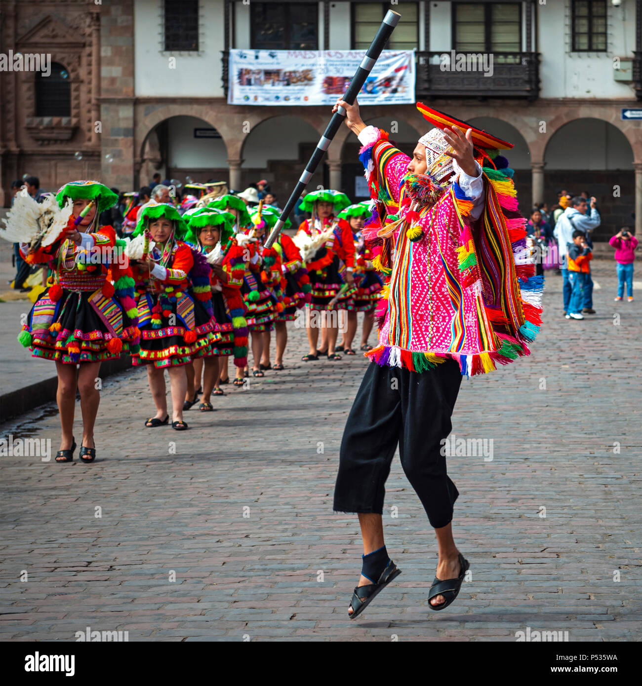 Young Quechua male dancer performing during the Inti Raymi Sun festival in traditional clothing and hat on the Plaza de Armas of Cusco, Peru. Stock Photo