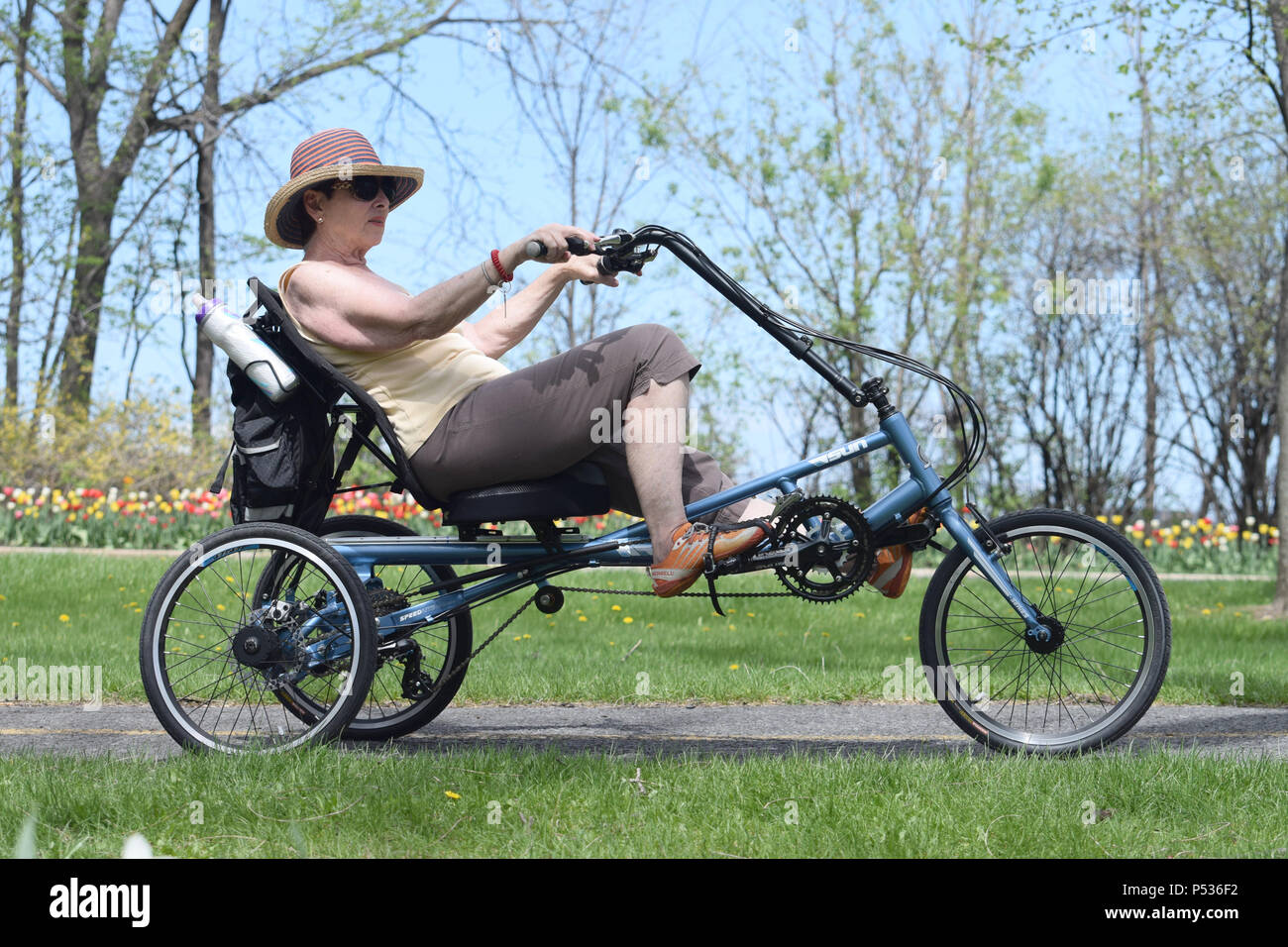 Riding a tricycle Stock Photo Alamy