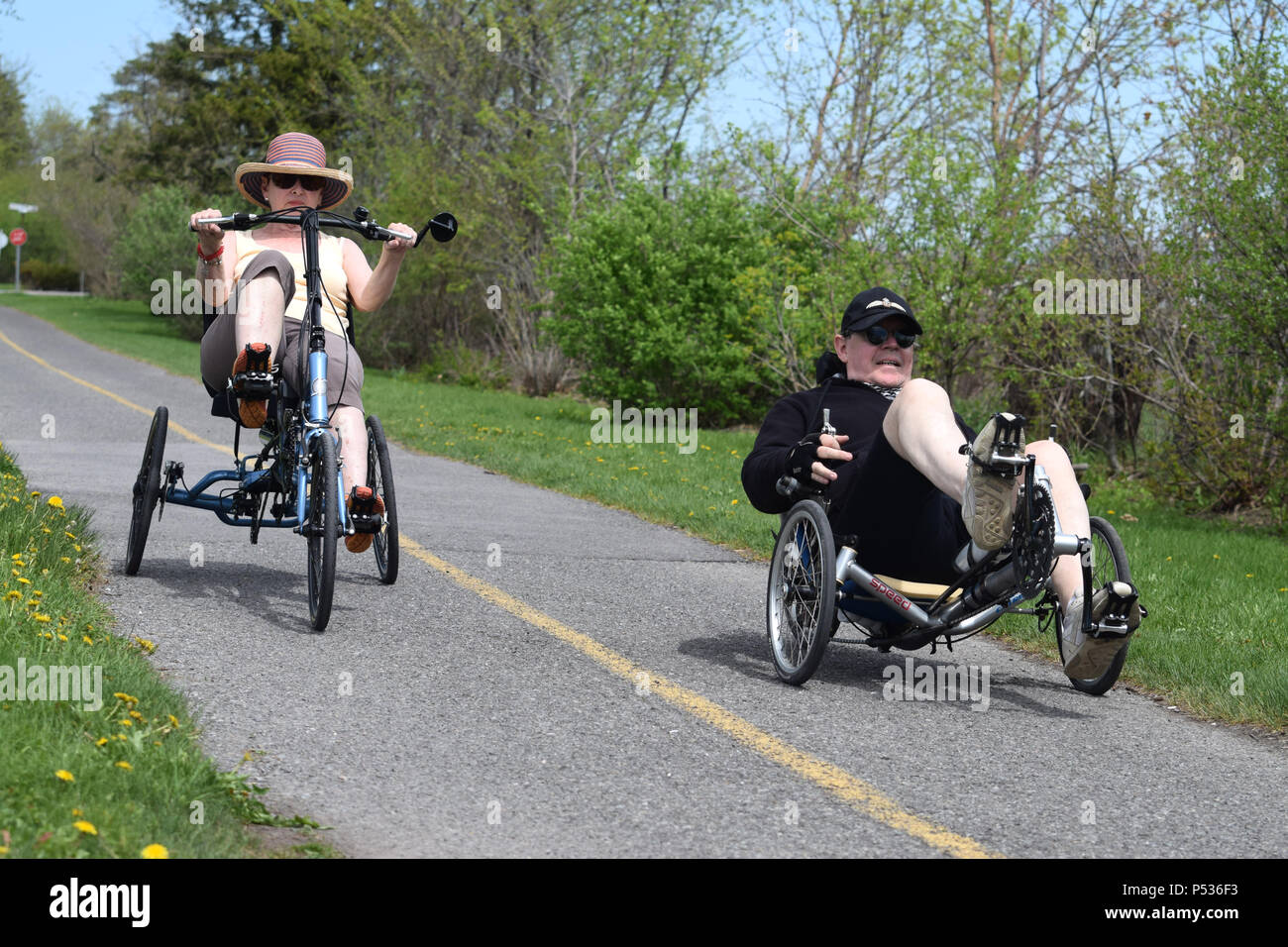 Riding a tricycle Stock Photo Alamy