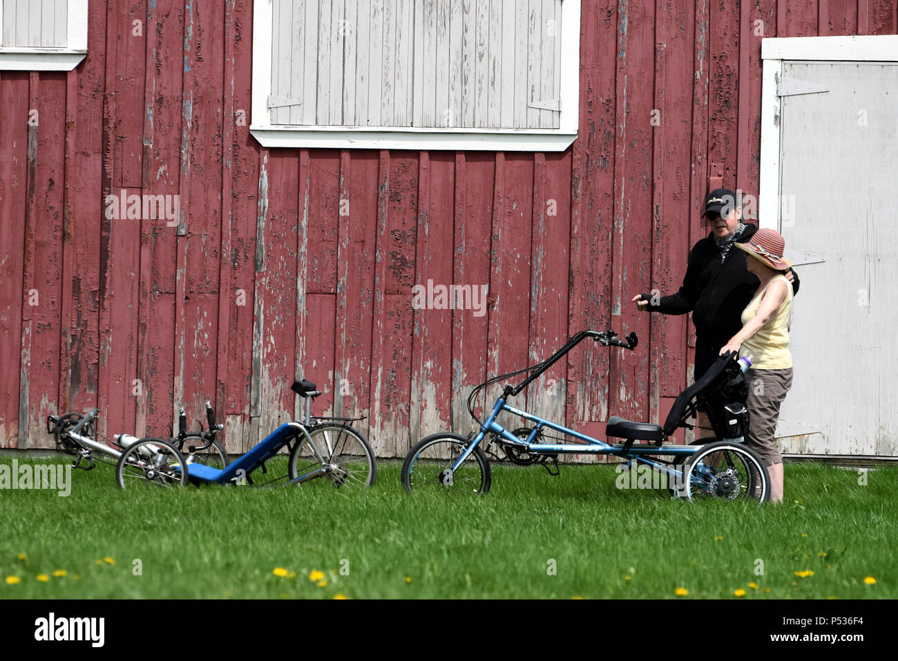 Riding a tricycle Stock Photo Alamy