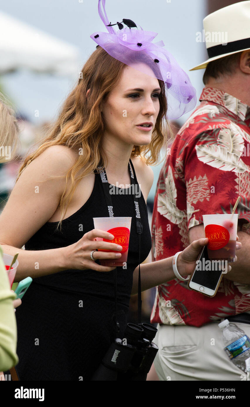 The Plains, Virginia/USA-5-19-17: Woman carries  drinks during The Virginia Gold Cup. Stock Photo