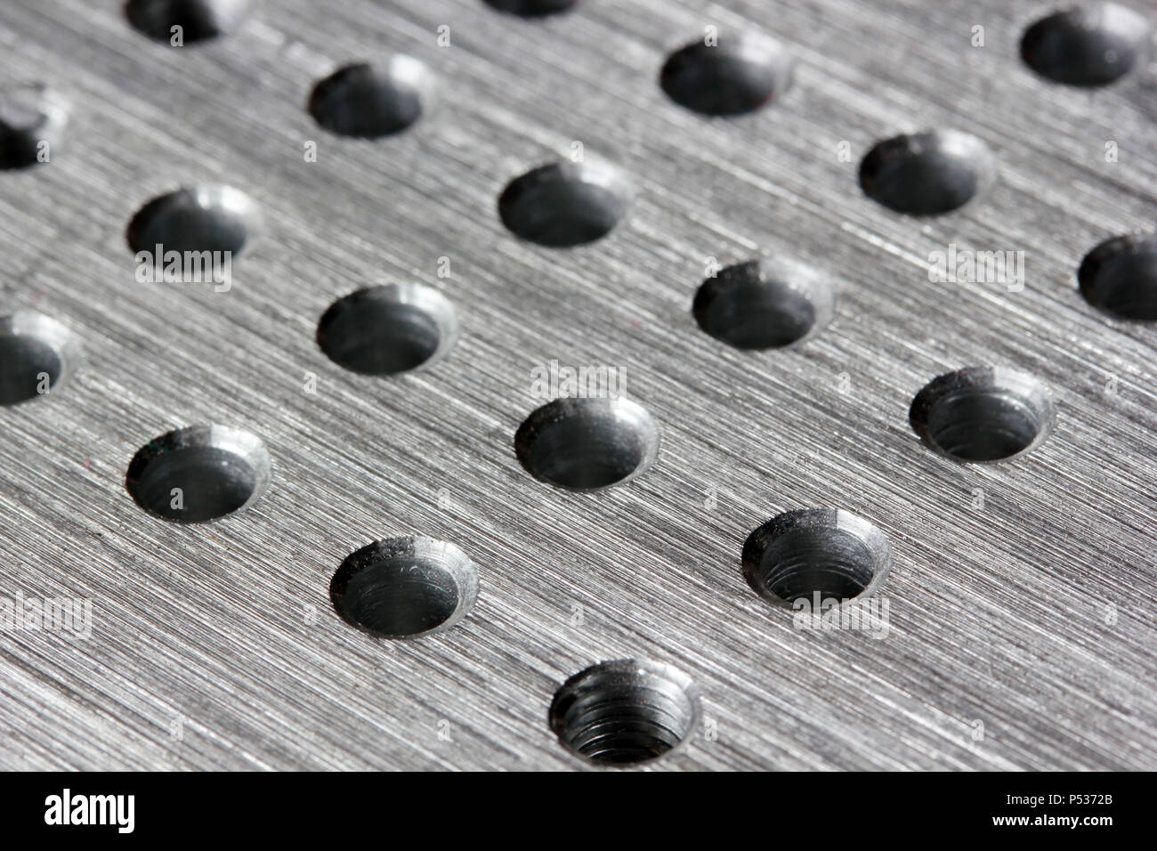 Silver metal background with round hole Stock Photo