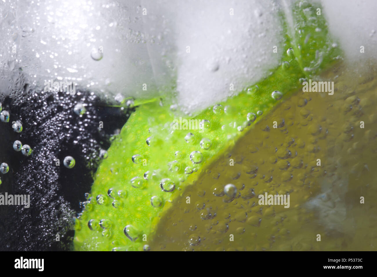 Lime Slice in Ice Water Stock Photo - Alamy