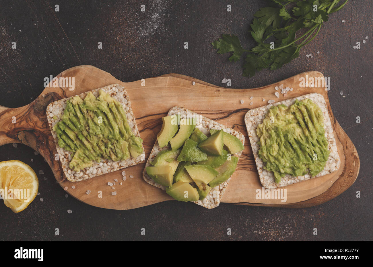 Avocado toasts with crispy rice bread, sandwiches with guacamole, top