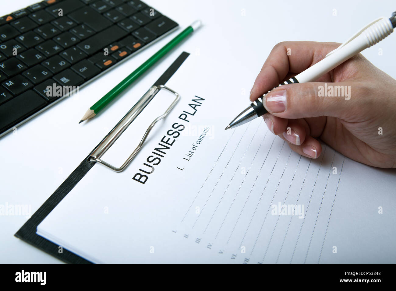 Business woman filling list in hi-res stock photography and images - Alamy