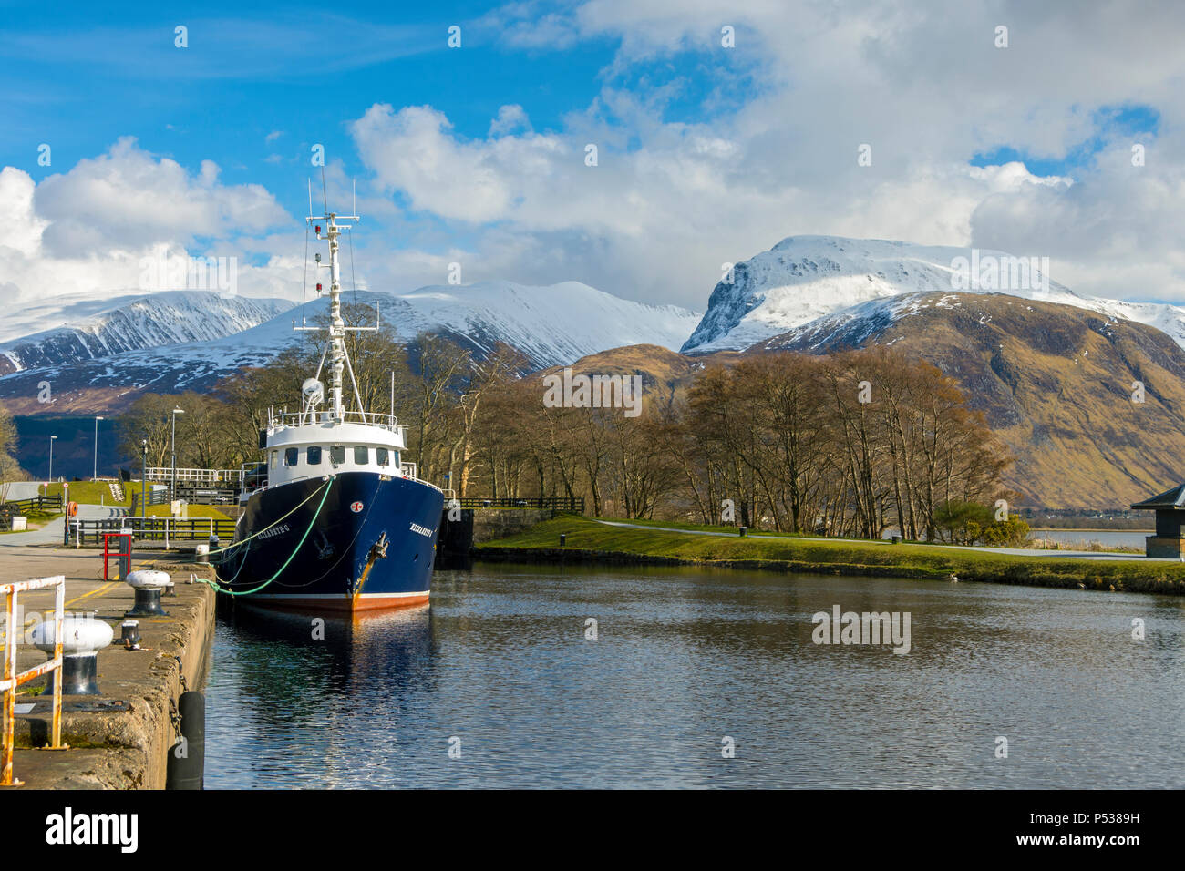 Ben Nevis from the Caledonian Canal at Corpach near Fort William, Highland Region, Scotland, UK. The boat is the Elizabeth G. Stock Photo