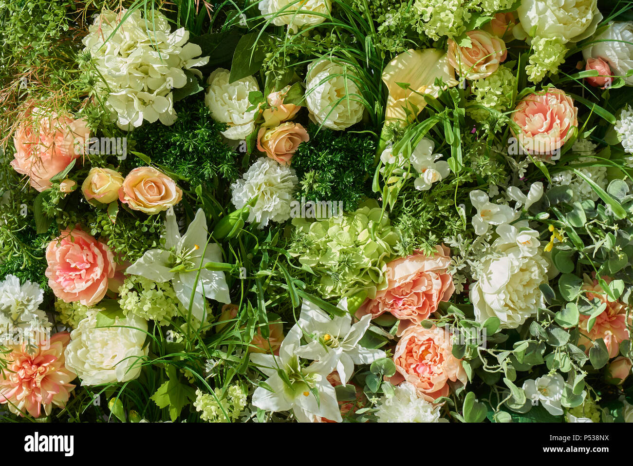 Variety of artificial flowers and plants as a background Stock Photo