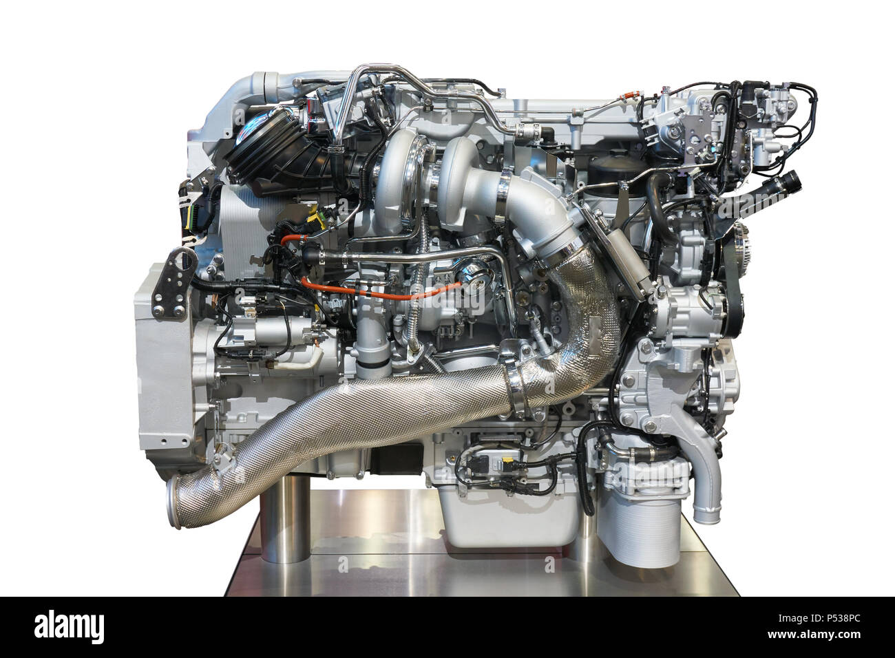 Side view of modern diesel engine of the heavy truck isolated on white