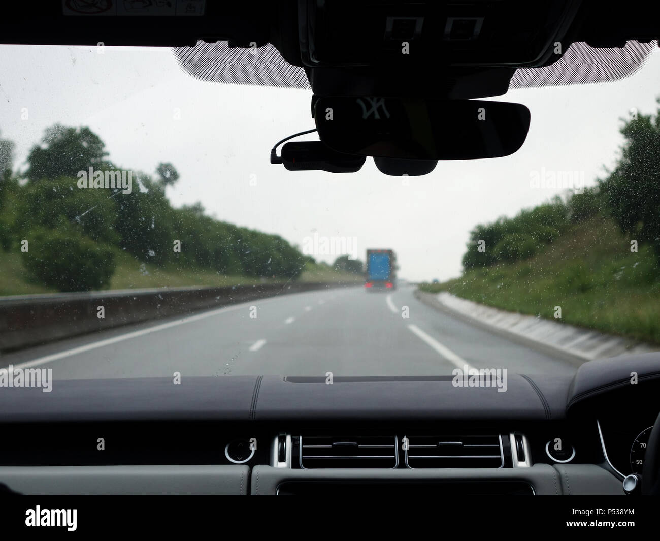 Driving in a Range Rover on clear empty roads through France Stock Photo