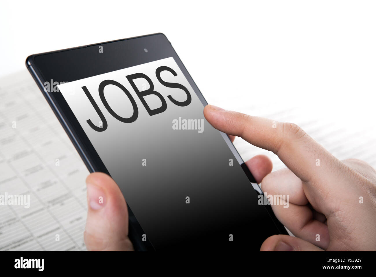 human hand pushing on a touch screen Stock Photo