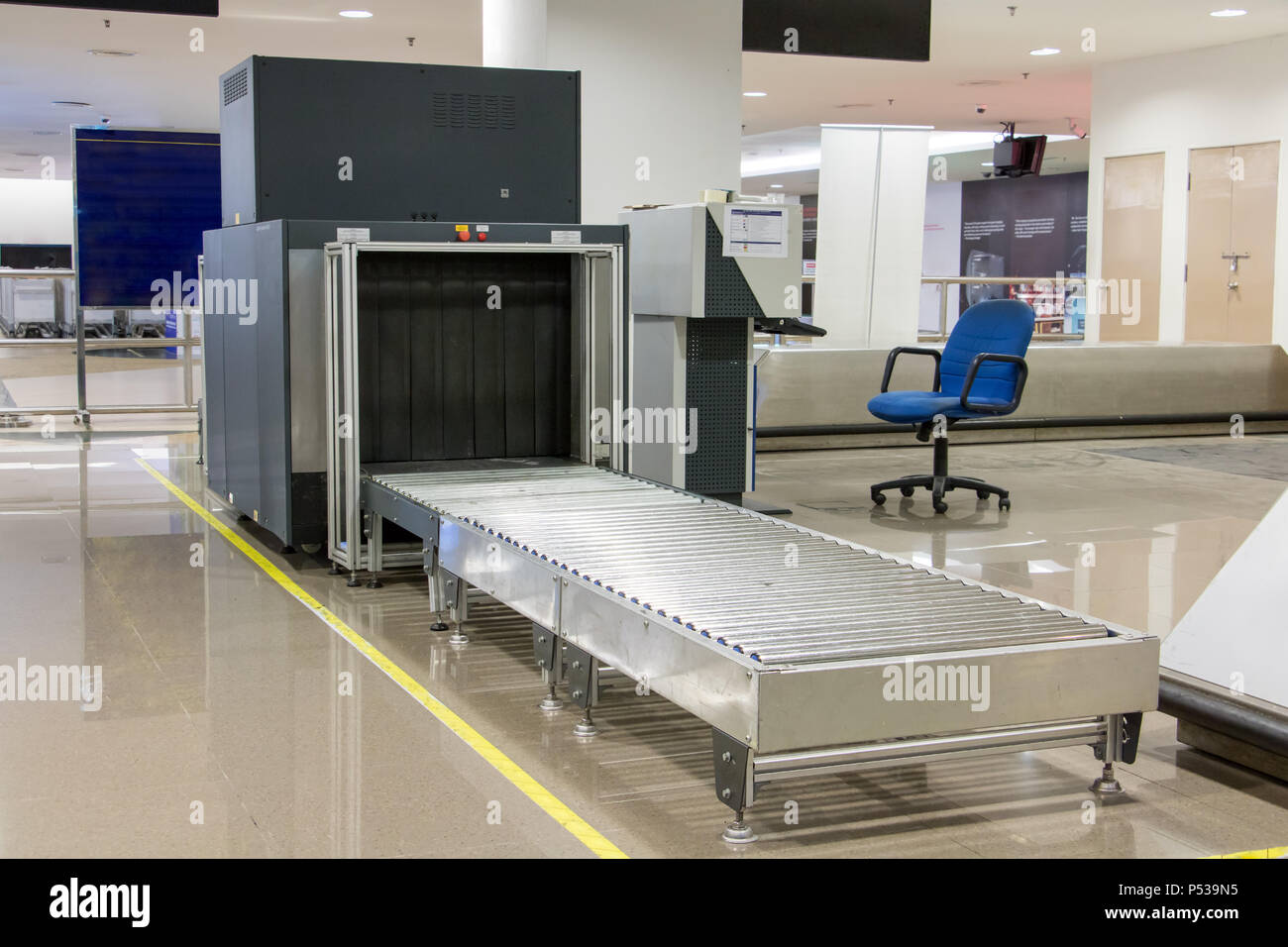 Airport security metal detector scan. Empty scanner control luggage at the terminal. Gate-ray detection with a belt for scanning bags. Check point. Stock Photo