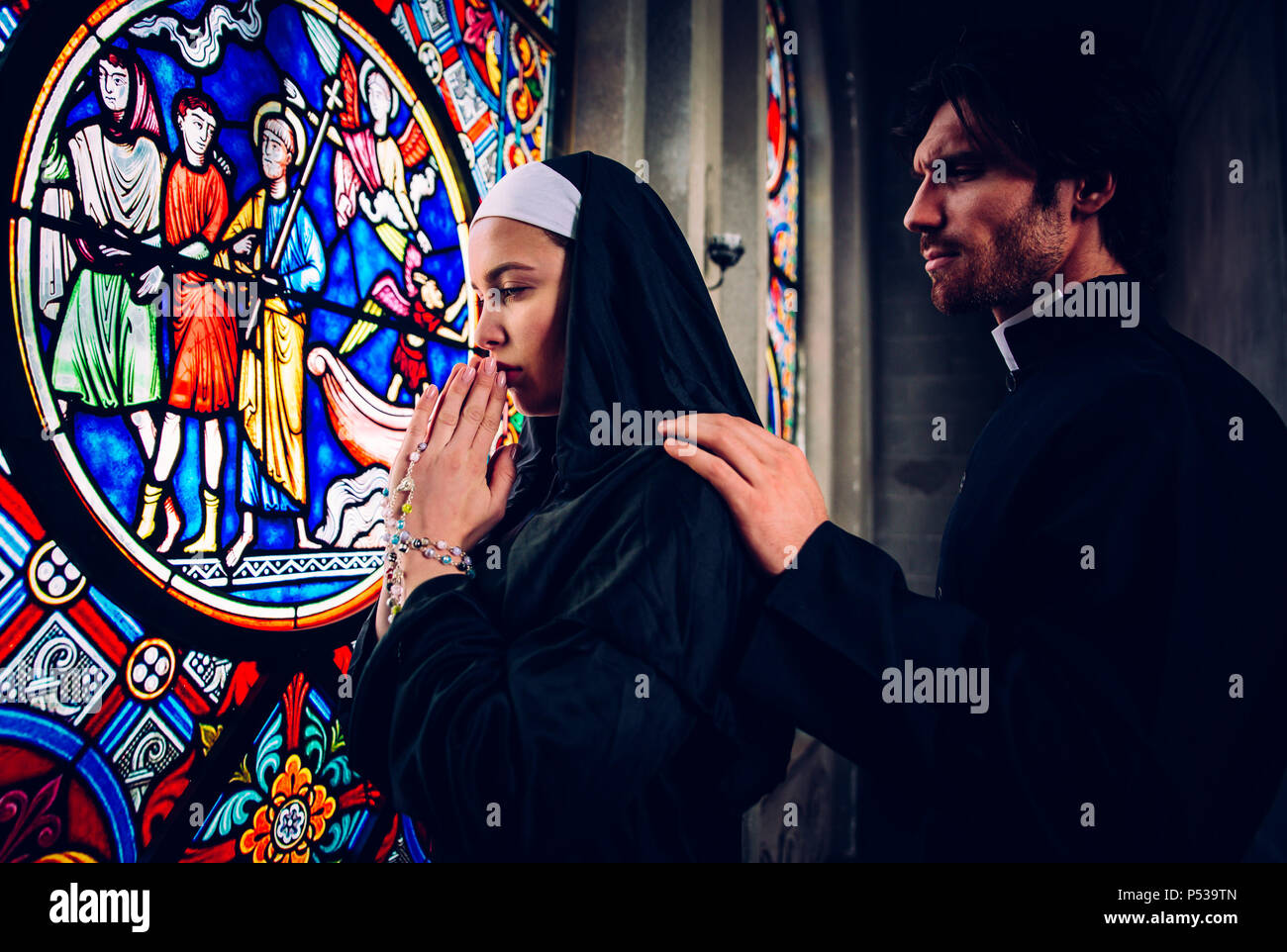 https://c8.alamy.com/comp/P539TN/nun-and-priest-praying-and-spending-time-in-the-monastery-P539TN.jpg