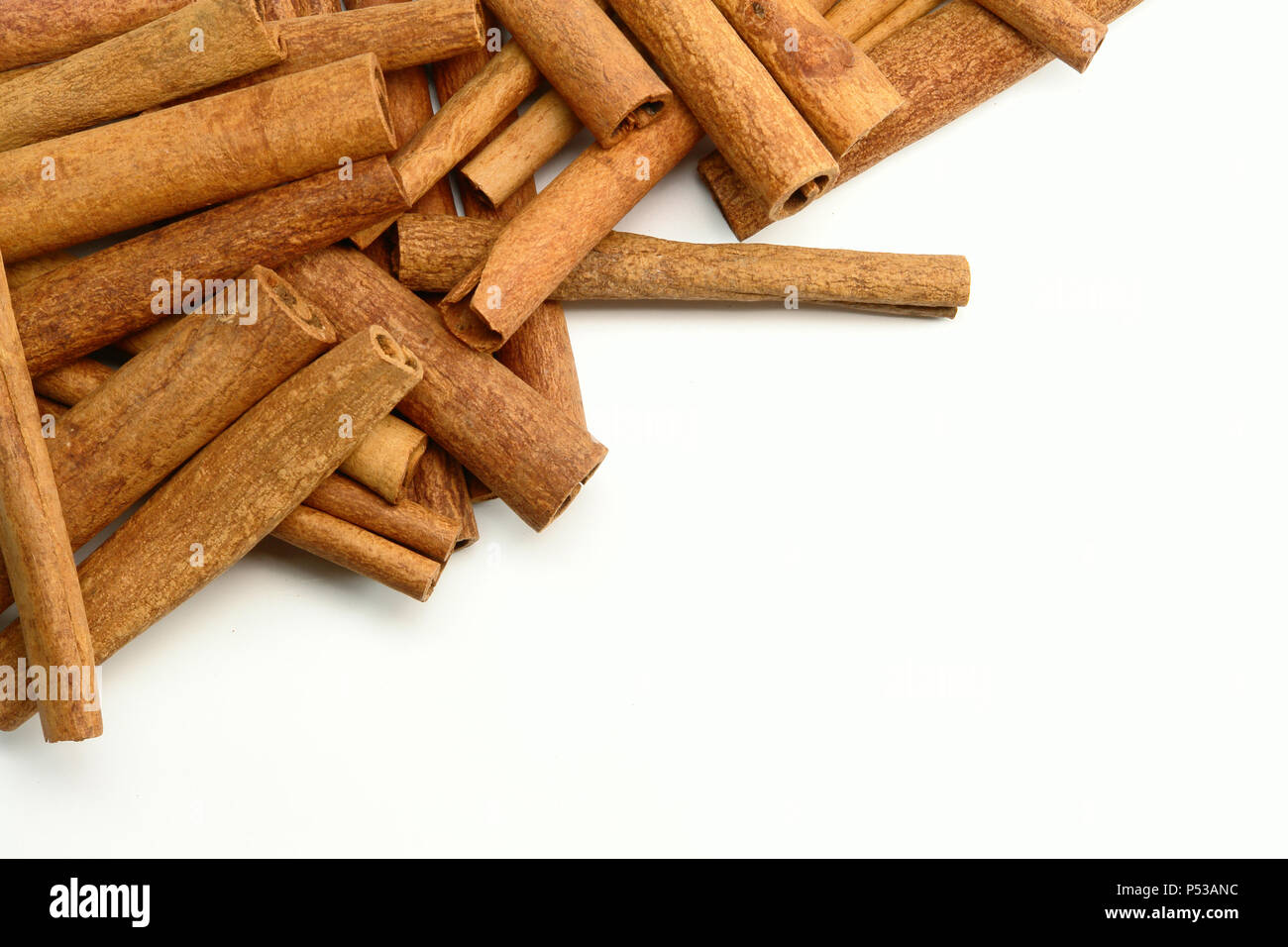Stack of Cinnamon Sticks (Isolated on white background) Stock Photo