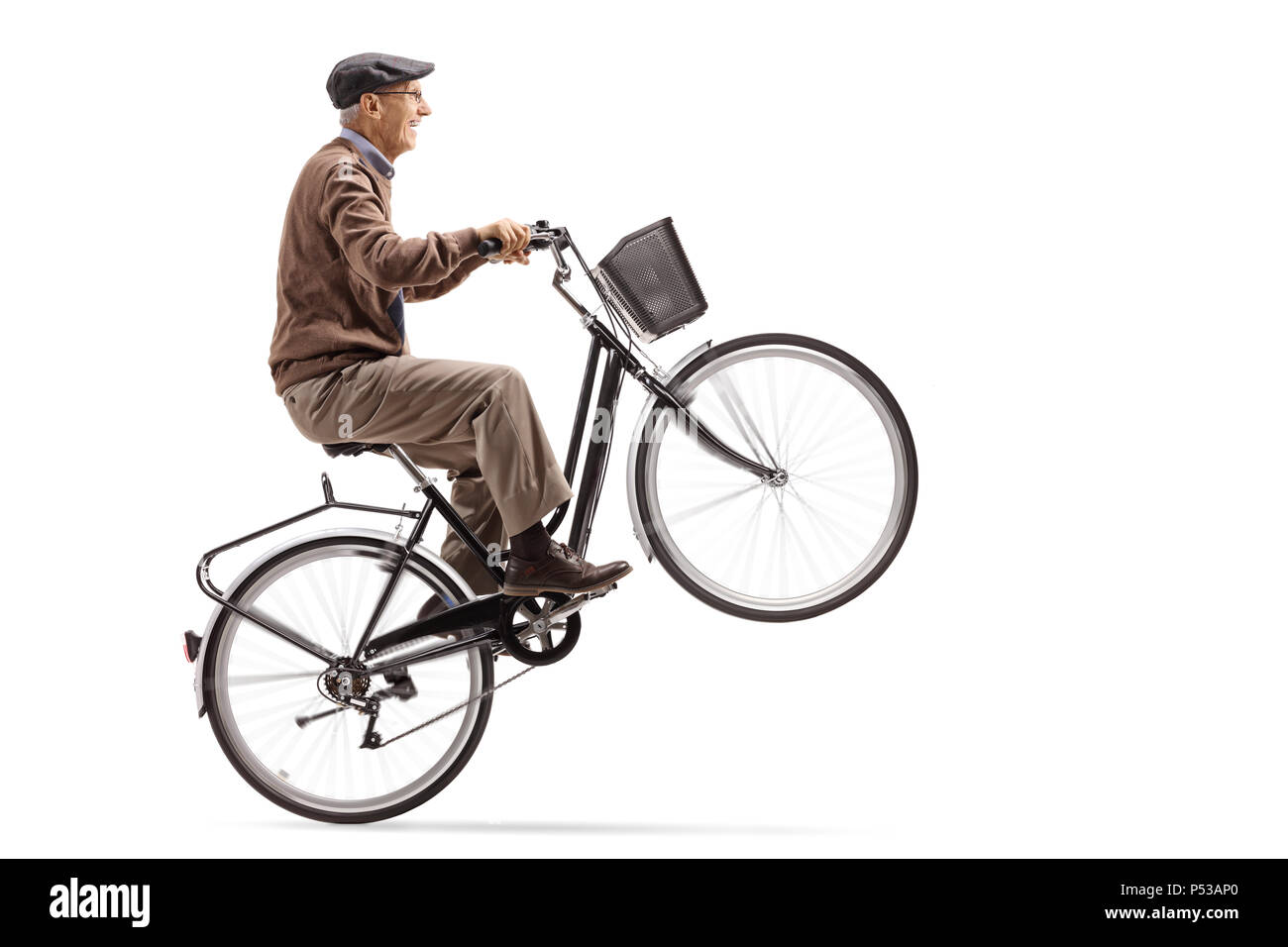 Mature man riding a bicycle and doing a wheelie isolated on white background Stock Photo Alamy