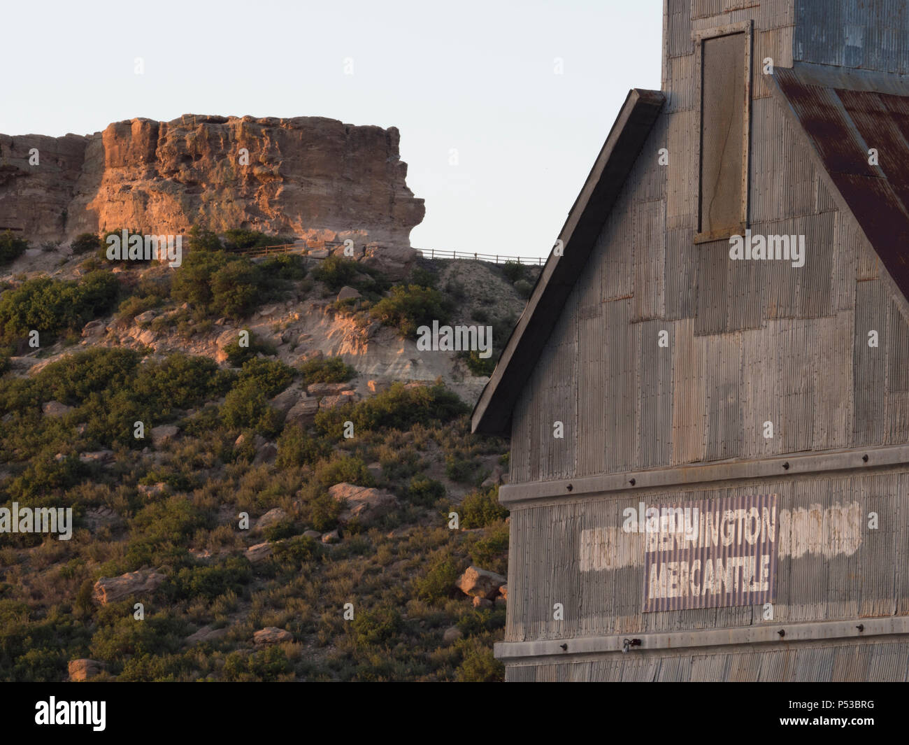 Castle Rock and the Bennington Mercantile building at sunset Stock Photo