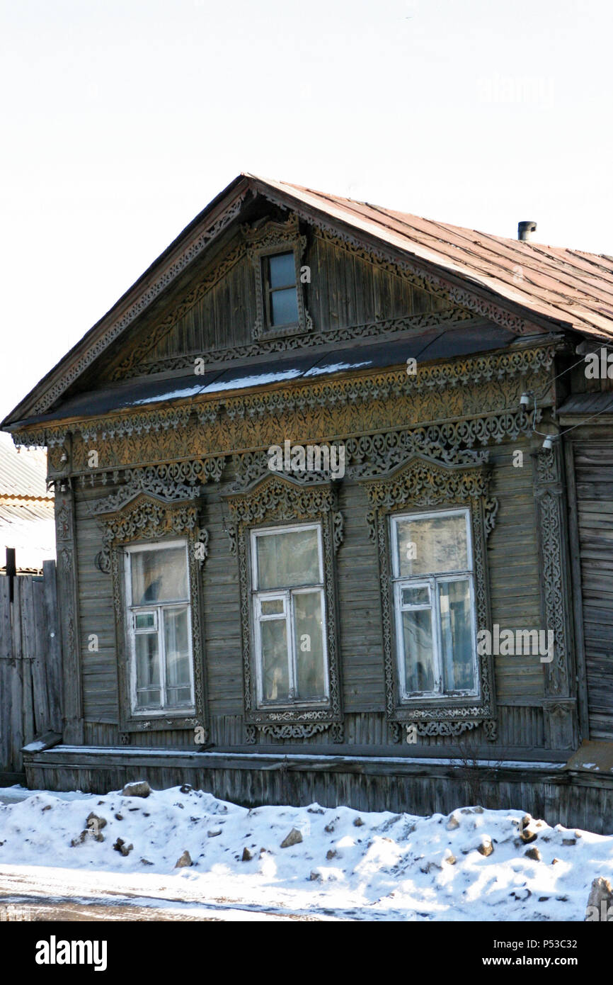 A wooden village house on a winter morning Stock Photo - Alamy