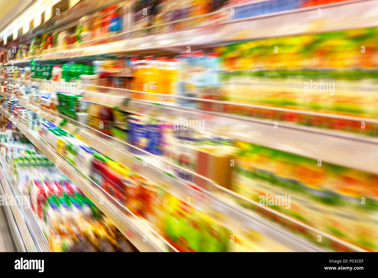 Blurred photos showcases shops. Long rows of racks with goods. Stock Photo