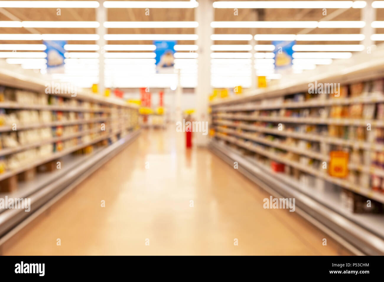 Blurred photos showcases shops. Long rows of racks with goods. Stock Photo
