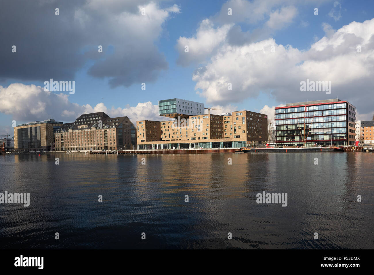 Berlin, Germany - View over the Spree at the Osthafen on historical and modern architecture on the Spreeufer in Friedrichshain. Stock Photo