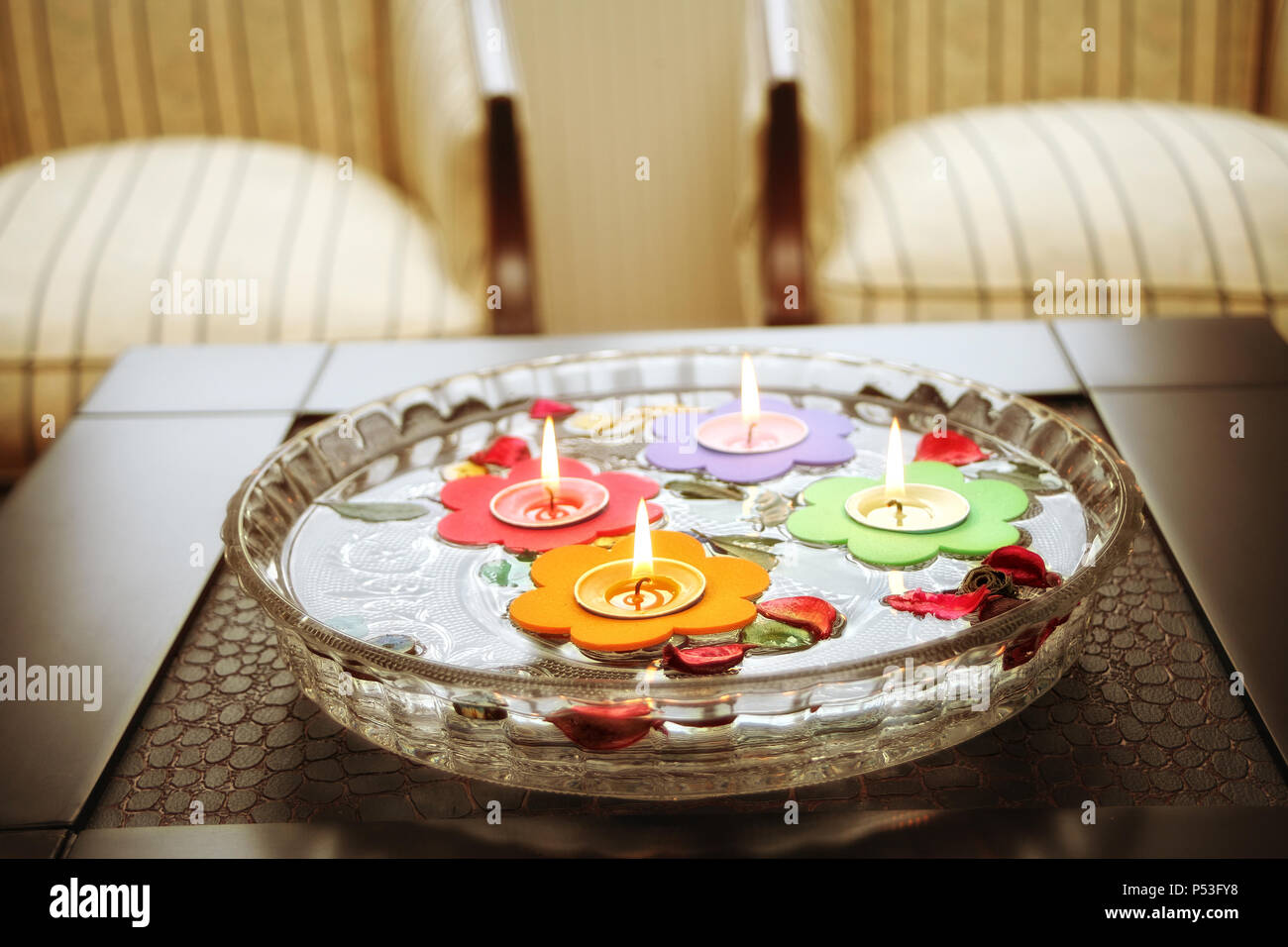 close up shot of floating candles in glass bowl Stock Photo Alamy