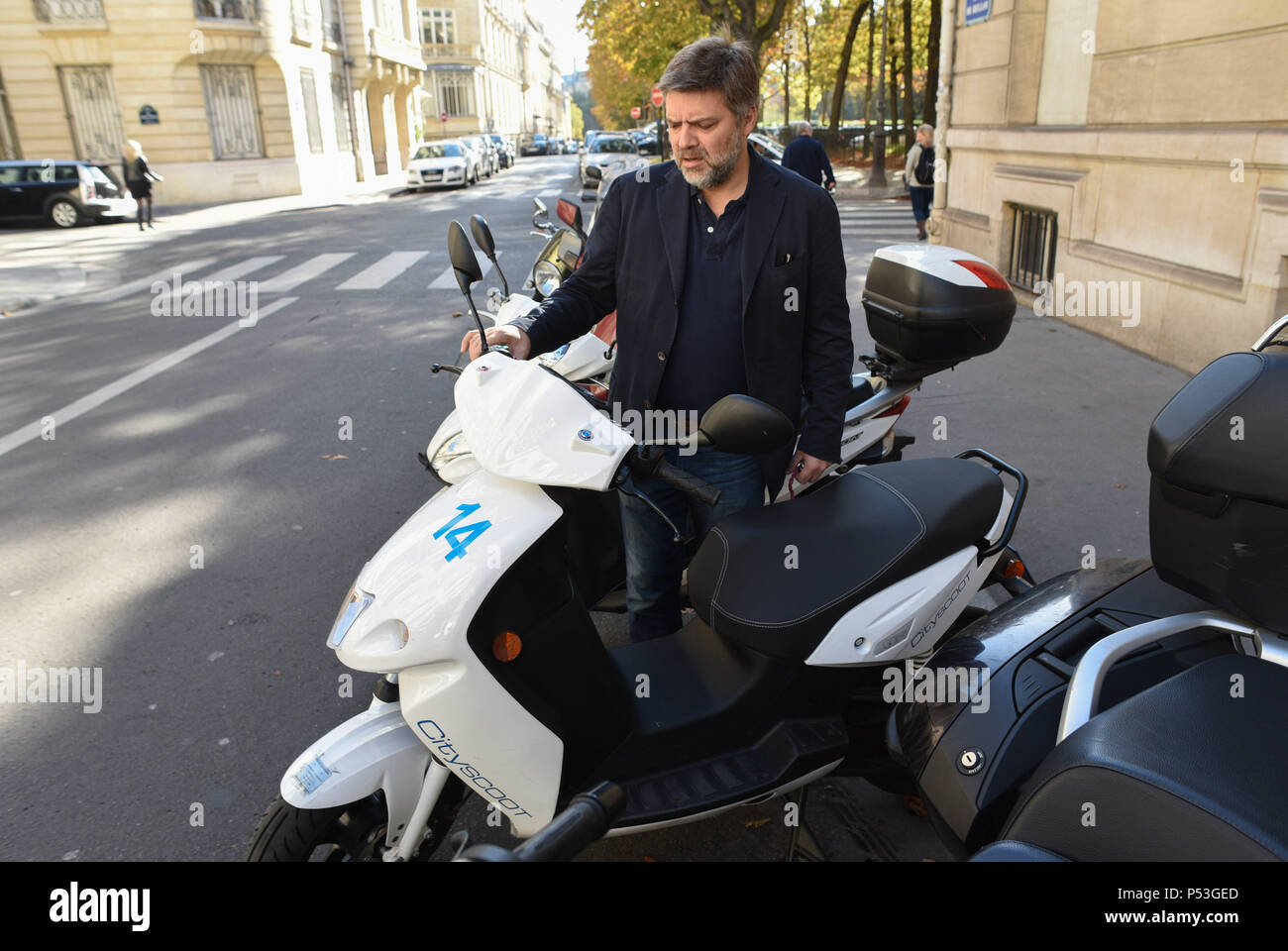 October 9, 2015 - Paris, France: Bertrand Fleurose, head of Cityscoot,  checks an electric scooter that will soon be available as part of a  self-service rental scheme in Paris. Cityscoot is the
