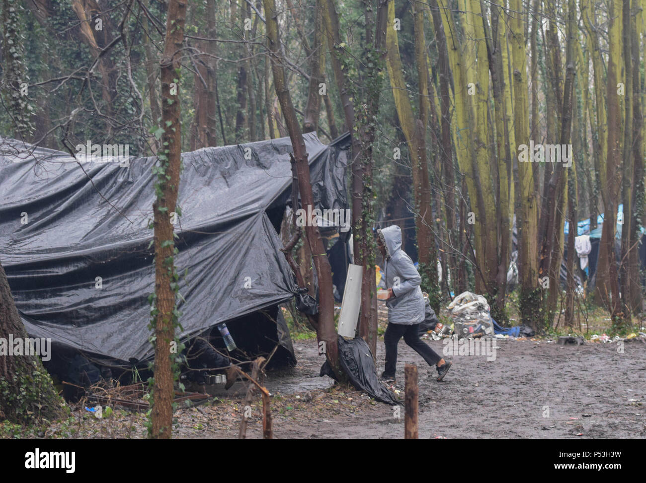February 20, 2015 - Calais, France: Hundreds of illegal migrants live in tents in an industrial zone of Calais as they wait for an opportunity to get to Britain. The migrants, who come mostly from Erythrea, Ethiopia, Afghanistan, Syria, and Sudan try their luck every night by discreetly boarding trucks about to enter the ferry boat or the Eurotunnel to England. Tentes de migrants dans la 'jungle' tioxide de Calais. Stock Photo
