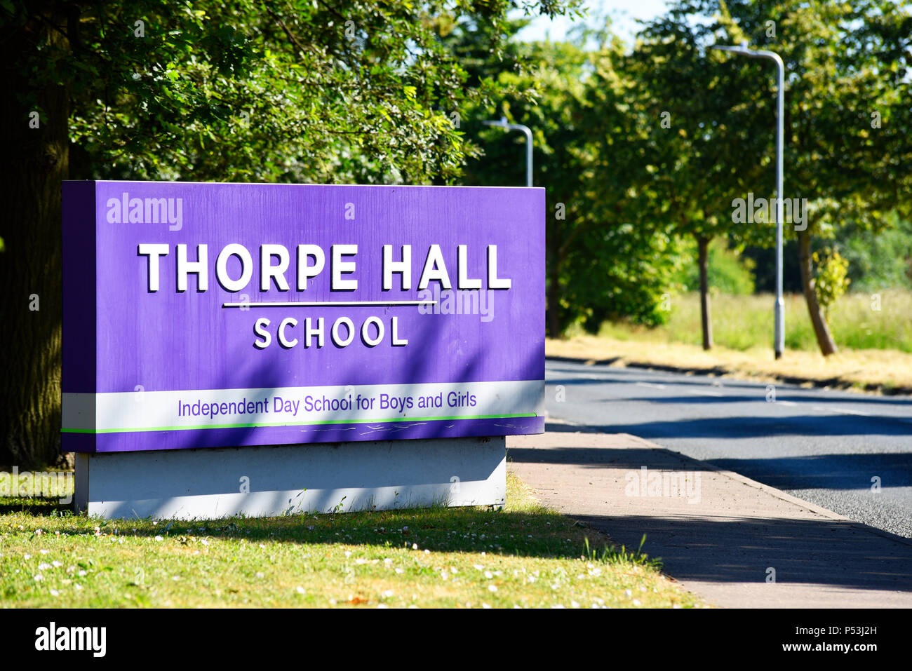 Thorpe Hall School sign, Southend on Sea, Essex, UK. Independent day school for boys and girls. Tree lined road. Wakering Road Stock Photo