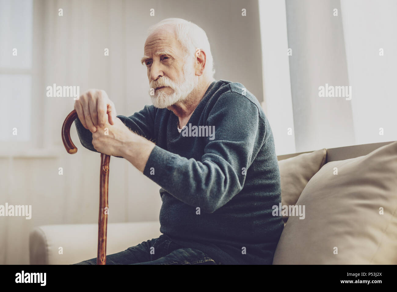 Sad aged man thinking about his life Stock Photo