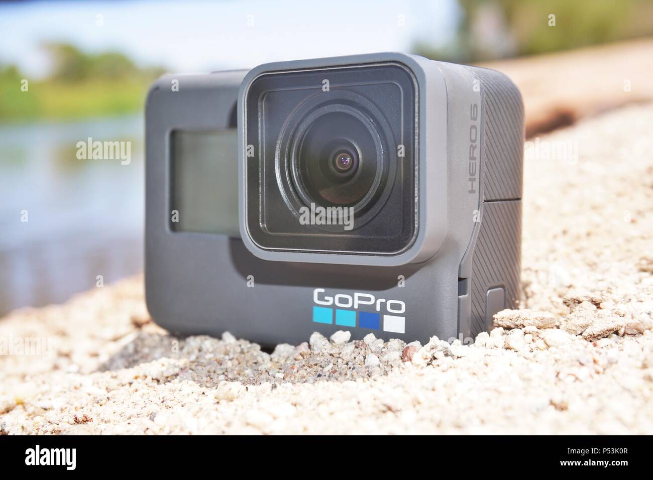GoPro camera laying on beach sand Stock Photo