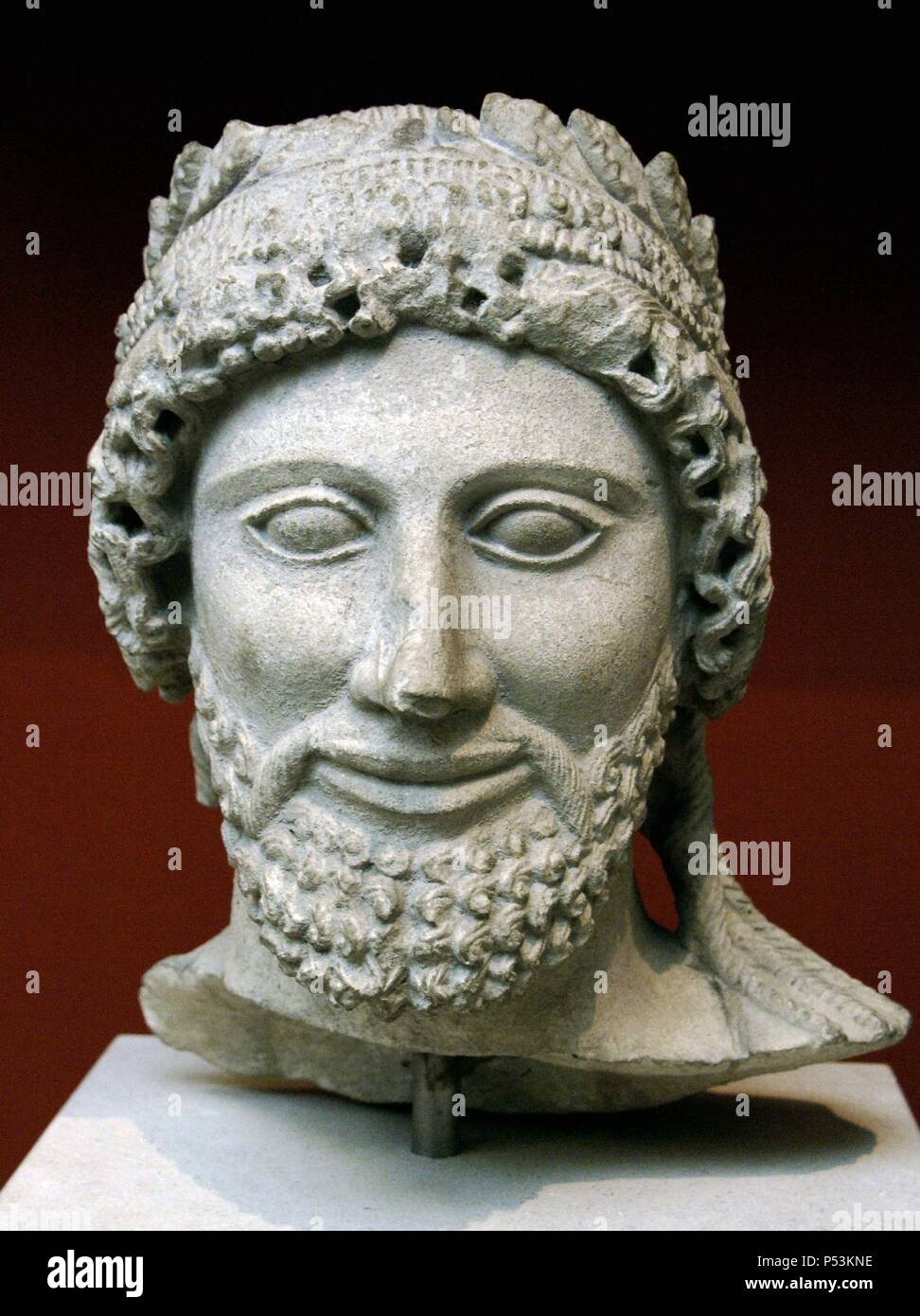 Head from a statue of a bearded man with laurel wreath. Limestone. Sculpted in Cyprus between 475-450 BC. From the Sanctuary of Apollo at Idalion. British Museum. London. England. United Kingdom. Stock Photo