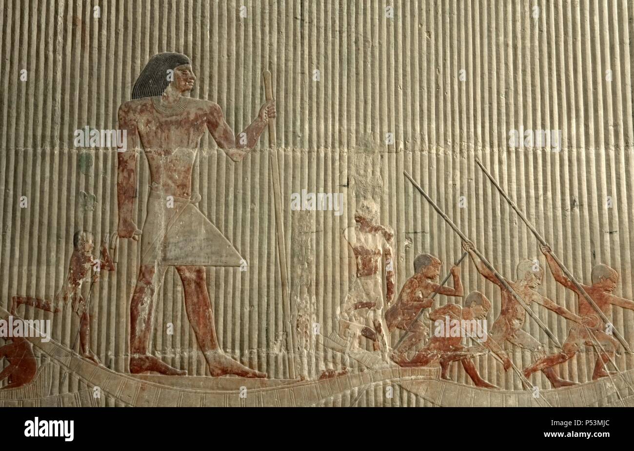 Egypt. Saqqara. Mastaba of Ti. Relief depicting hunting scene. Hunters nailing his lances into the hippos and crocodiles while Ti, depicted with a dwarf, standing on a papyrus boat presiding over a hippopotamus hunt. Detail. 5th Dynasty. Old Kingdom. Stock Photo