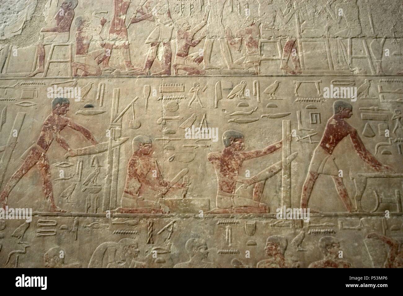 Egypt. Saqqara. Mastaba of Ti. Ca. 2400 B.C. 5th Dynasty. Old Kingdom. Relief depicting artisans cutting wood. Stock Photo