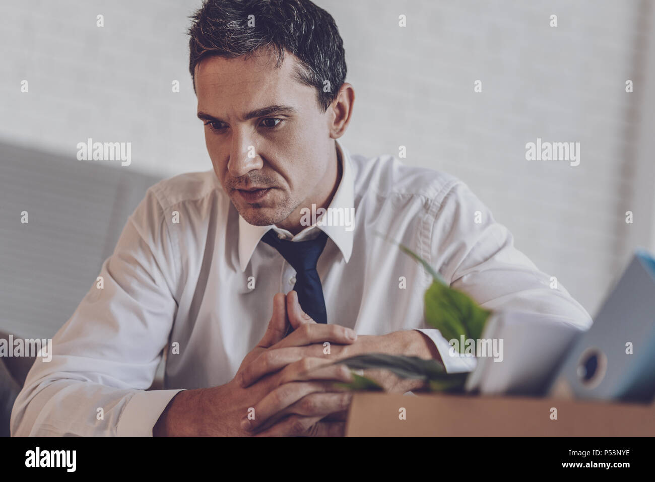 Nice young man feeling upset Stock Photo
