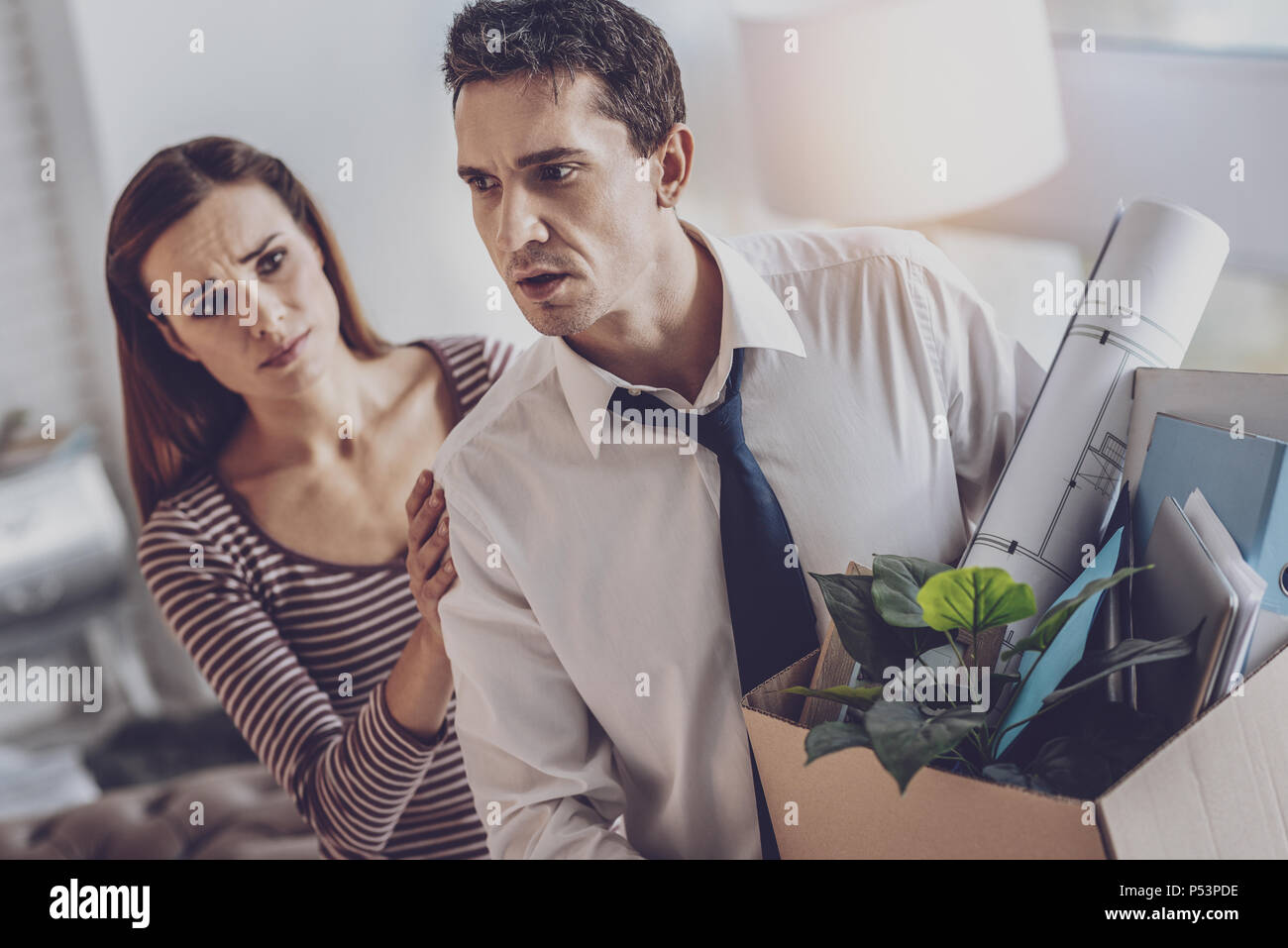 Depressed cheerless man thinking about his life Stock Photo