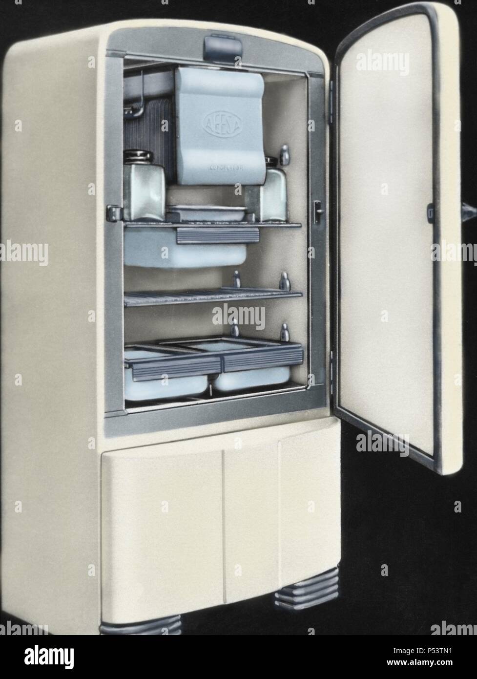 First electric refrigerator produced in Spain by AEESA brand (Anglo-Espanola de Electricidad SA). 50's. Colored. Stock Photo