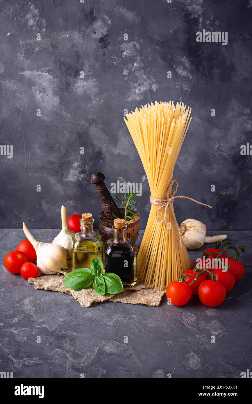 Pasta, tomatoes, olive oil and vinegar Stock Photo Alamy