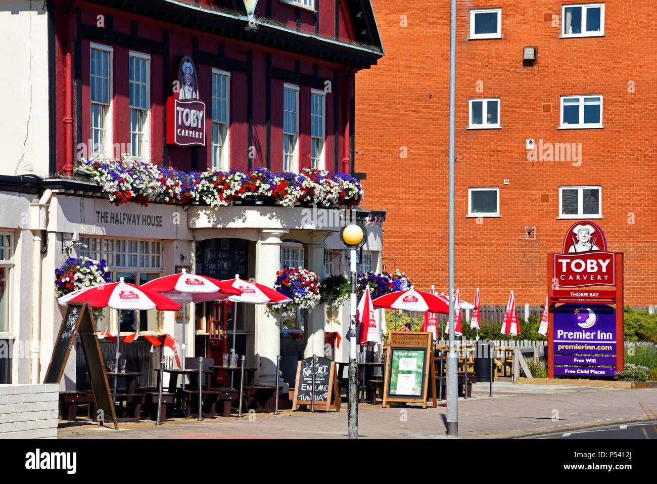 Toby Carvery in Thorpe Bay near Southend on Sea, Essex. The Halfway House pub. Restaurant chain. flower adorned exterior. sunny Stock Photo