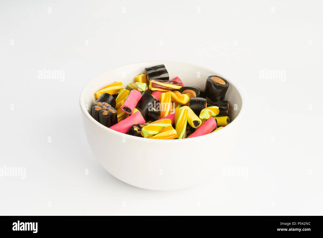 Details of colorful tasty sweet finish licorice candy on white ...