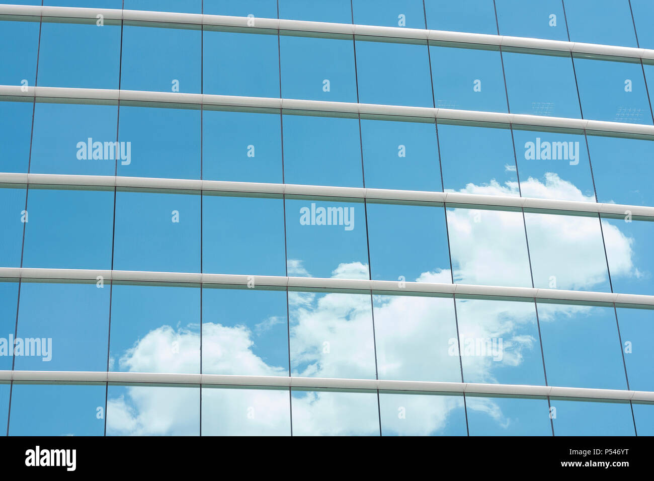 blue glass wall of office building with sky reflect Stock Photo Alamy
