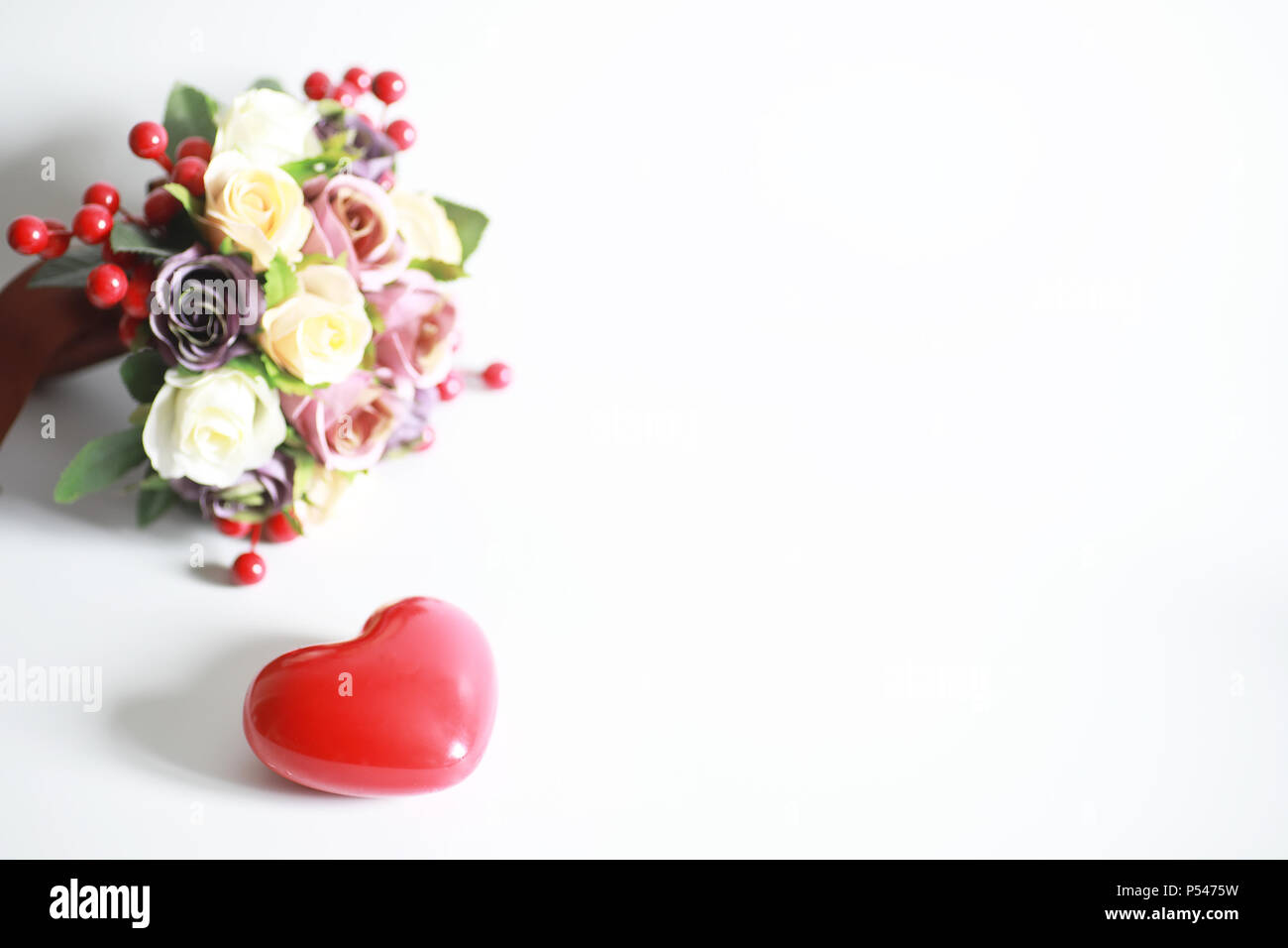 Bouquet of flowers on a white background and a figure in the shape of a ...