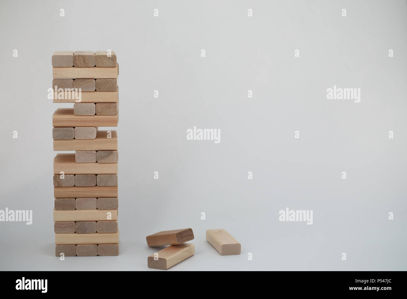 Board game jenga tower of light wood sticks Stock Photo - Alamy