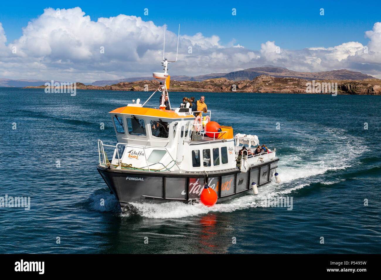 The Staffa Tours boat 'Fingal' arrives back at Baile Mor on the Hebridean island of Iona, Argyll and Bute, Scotland, UK Stock Photo