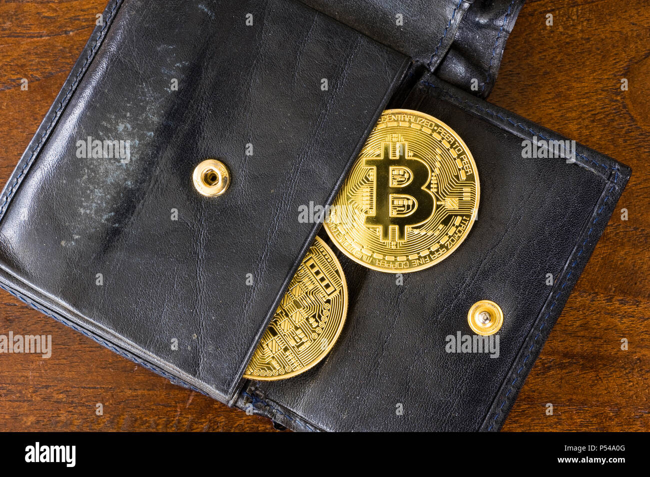 Two bitcoins in a wallet Stock Photo
