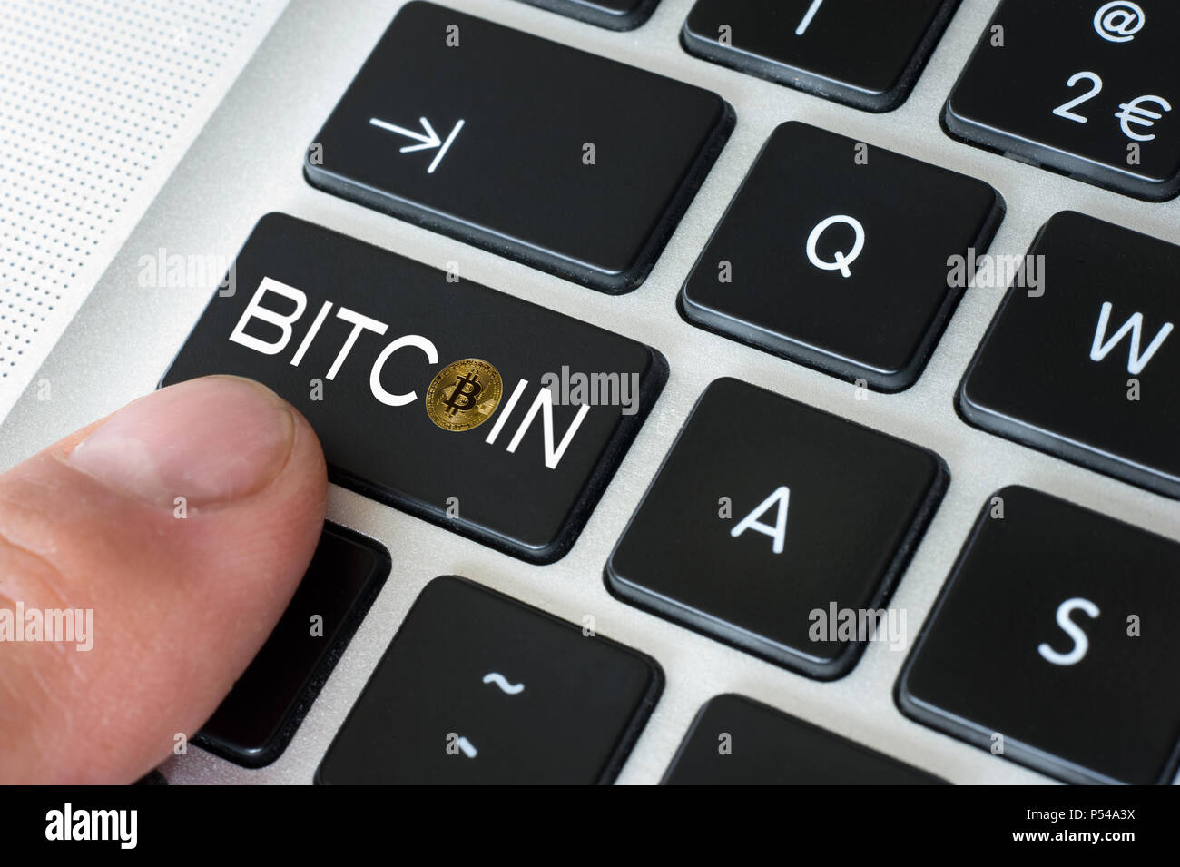 Bitcoin in one of the keys of the keyboard of a computer Stock Photo