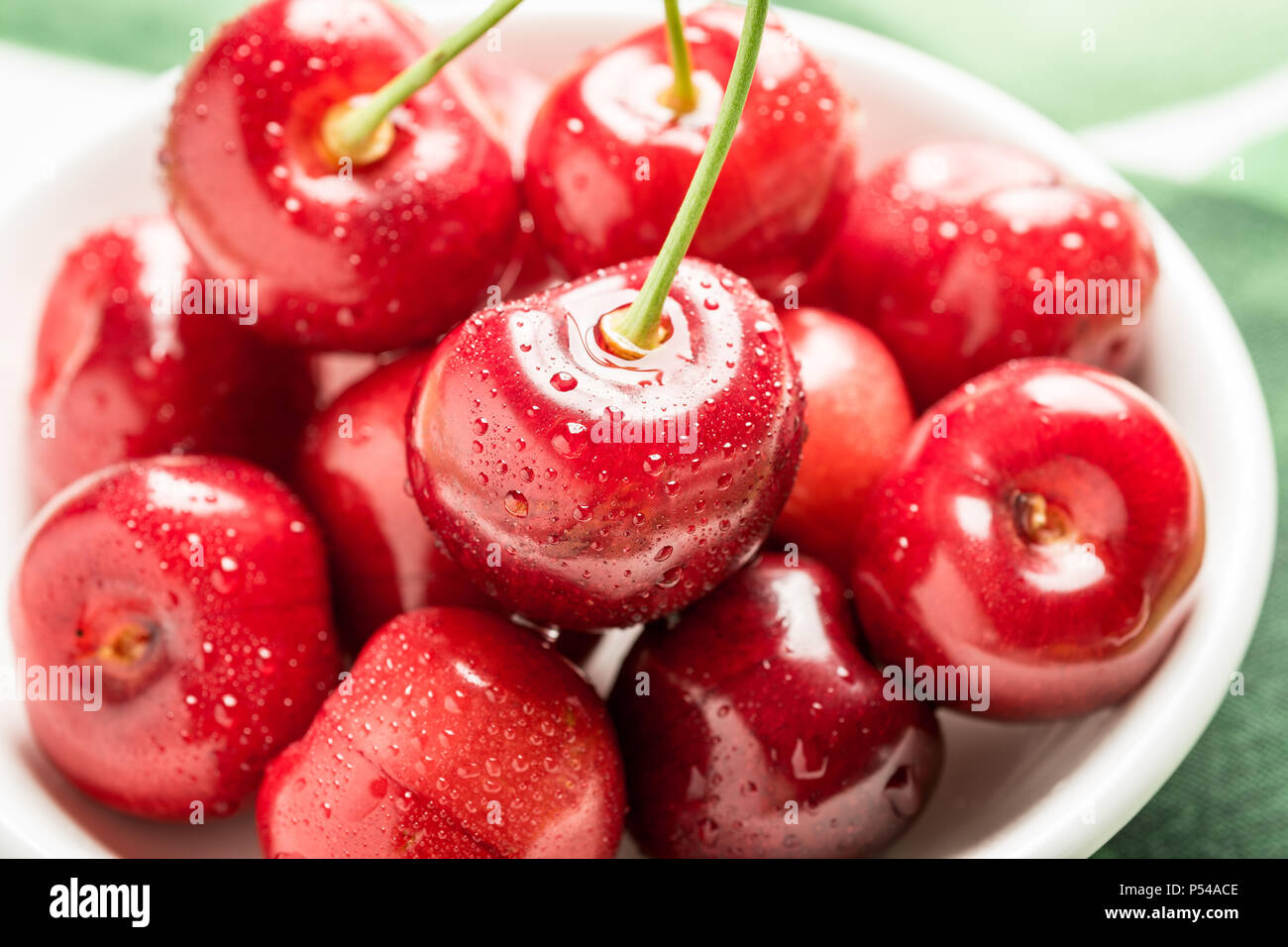 Fresh Red Cherries in White Bowl as Summer Concept Stock Photo