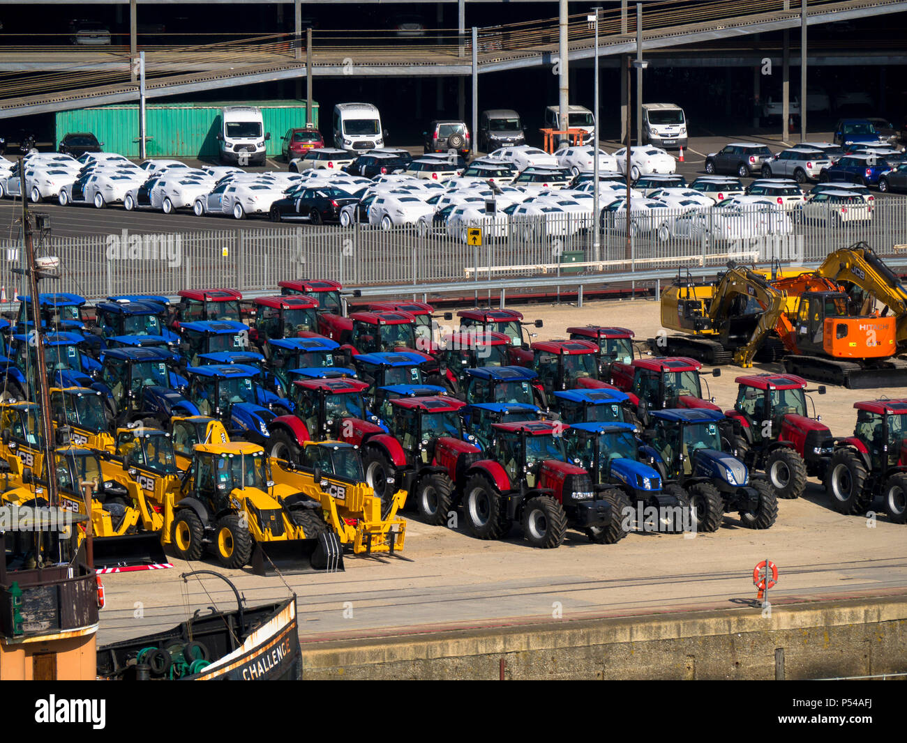 Cars tractors and heavy plant machinery ready for export at the busty port of Southampton docks, England Stock Photo