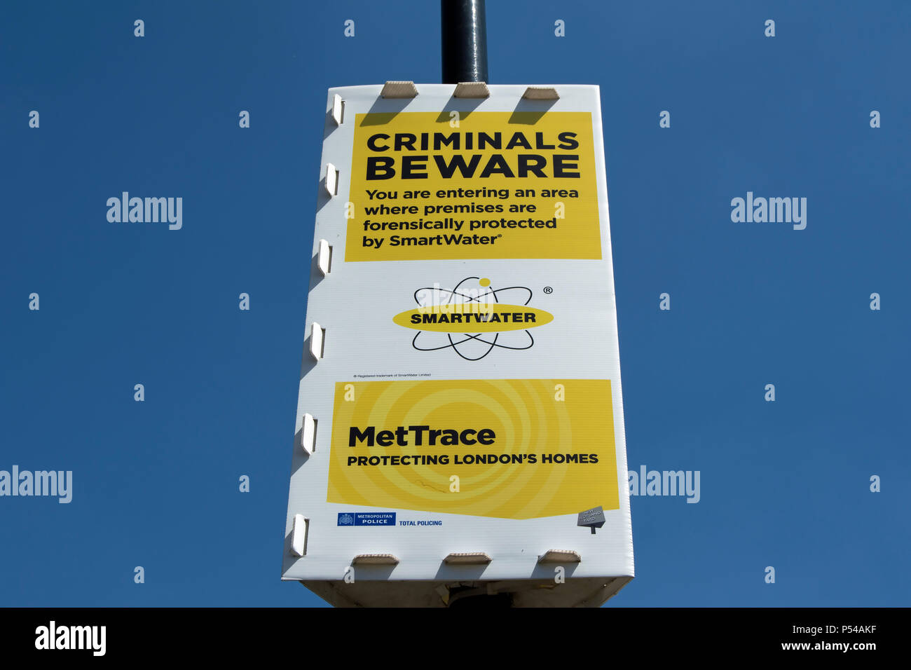 metropolitian police criminals beware sign, promoting mettrace and sweetwater initiatives to combat burglaries, in chiswick, london, england Stock Photo