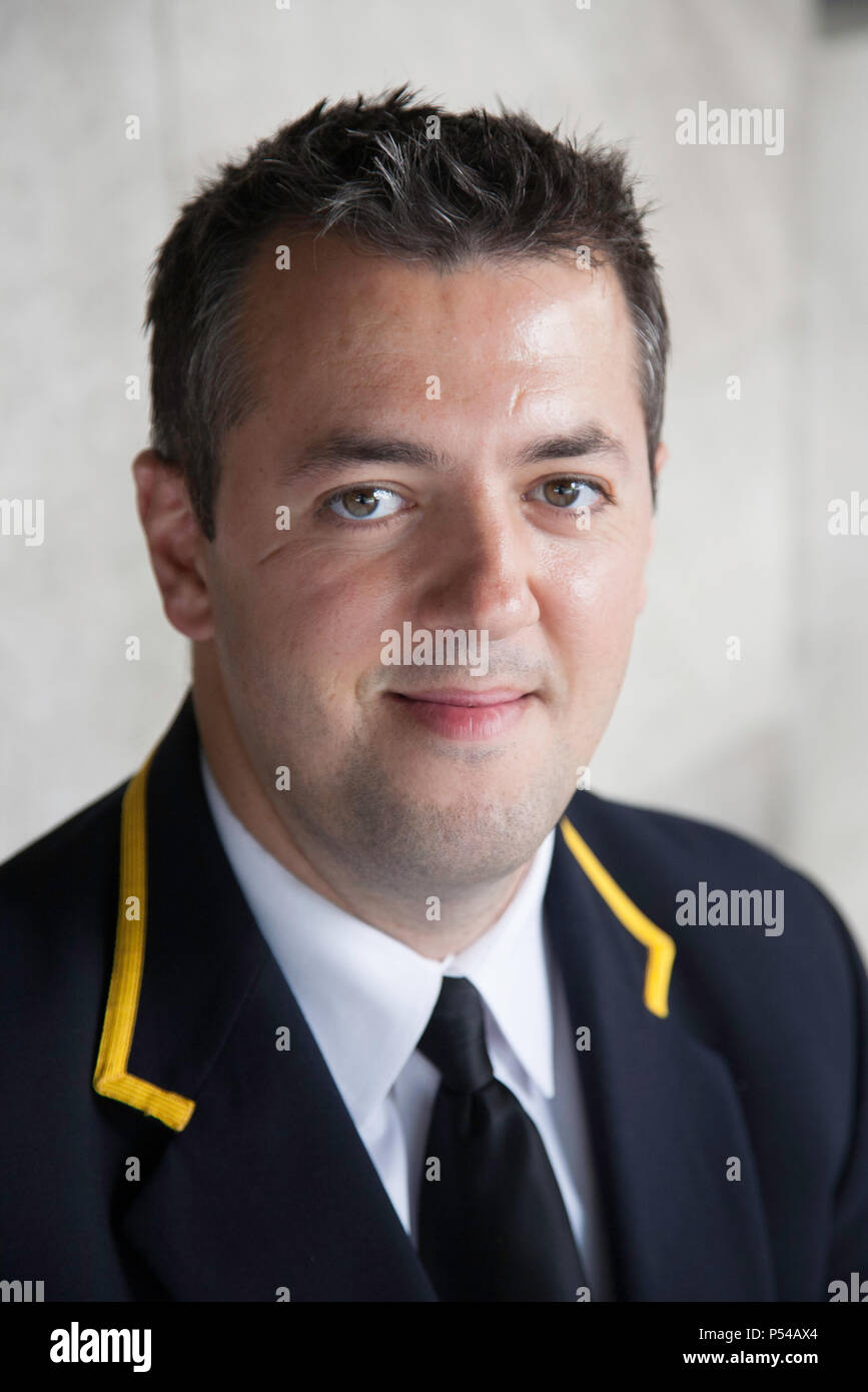 Handsome Uniformed Coop Doorman and Concierge, NYC, USA Stock Photo