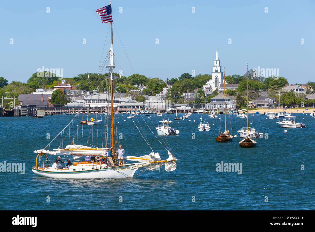 Sloop 'Endeavor' among sailboats and other pleasure craft moored in Nantucket harbor in Nantucket, Massachusetts. Stock Photo