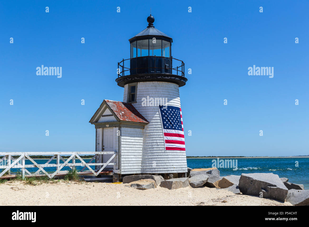 Brant Point Lighthouse protects mariners entering Nantucket Harbor on Nantucket Island. Stock Photo